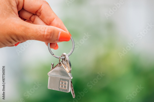 Wallpaper Mural hands with house keychain and keys in blurred background Torontodigital.ca