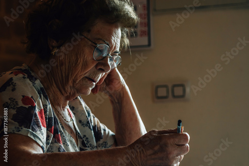 Wallpaper Mural senior woman at home writing puzzles or crosswords Torontodigital.ca