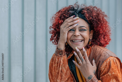 Wallpaper Mural black woman smiling out loud in the street outdoors Torontodigital.ca