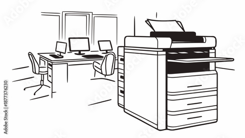 A large office printer stands near a desk with computers in a modern office setting viewed from the side