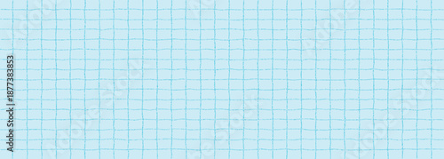 Textured sheet of blue checkered paper with a stipple effect. Cute pastel color background, irregular geometric pattern, notebook page.
