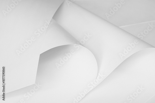 Sheets of white paper in black and white.