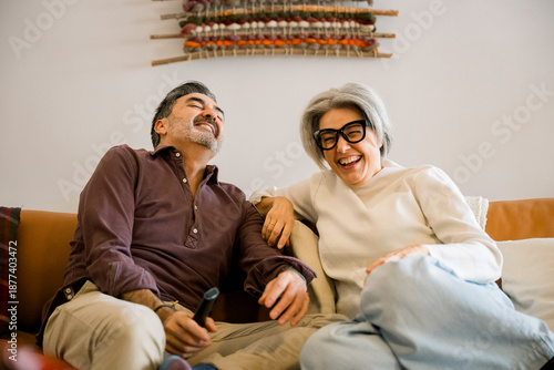 Senior couple sharing laughter and joy at home