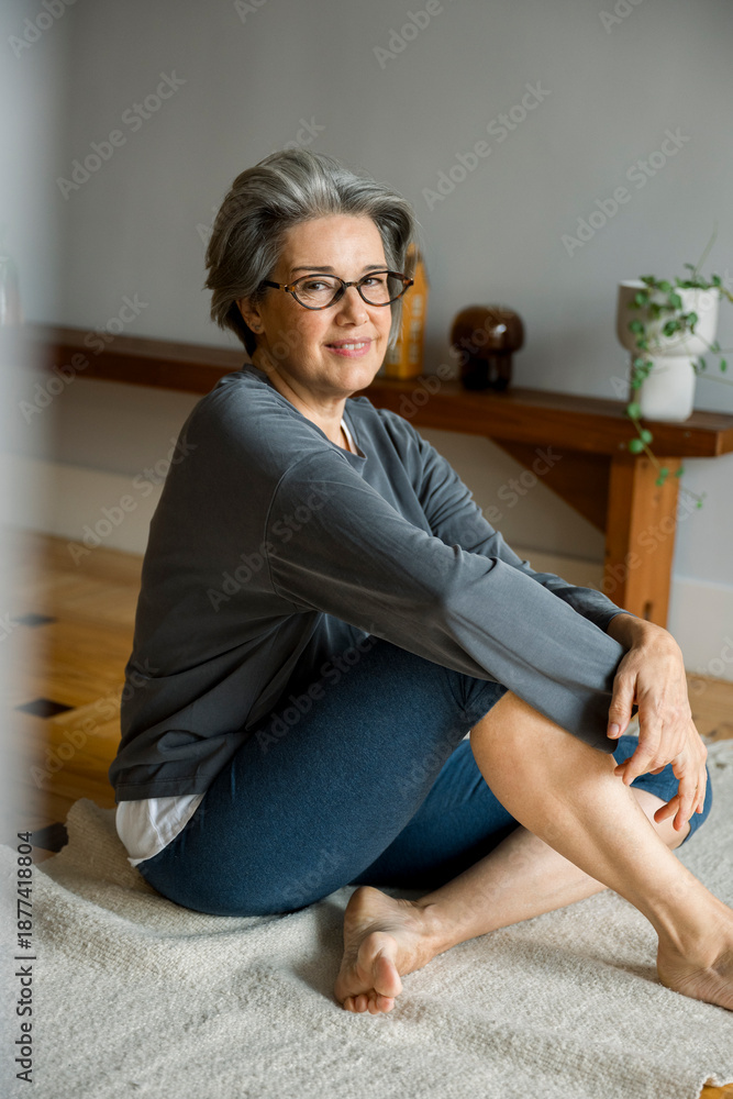 Obraz premium Mature woman enjoying wellness and mindful living at home