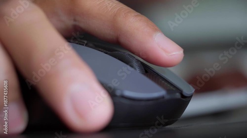 Close-up of Hand Using Computer Mouse at Desk