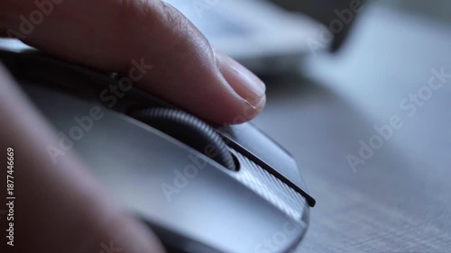 Hand Using Computer Mouse at Desk