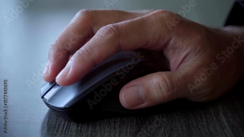 Close-Up of Hand Using Computer Mouse on Desk