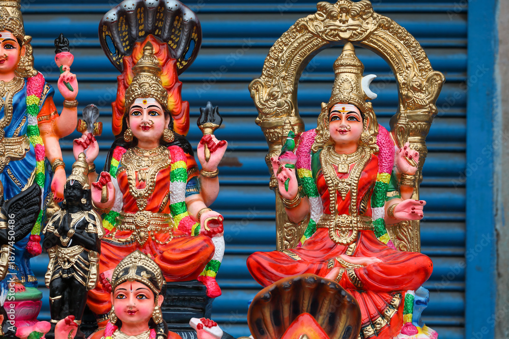 Fototapeta premium Karumari Amman and Kamatchi Amman idols are displayed for sale in a shop for the Golu festival