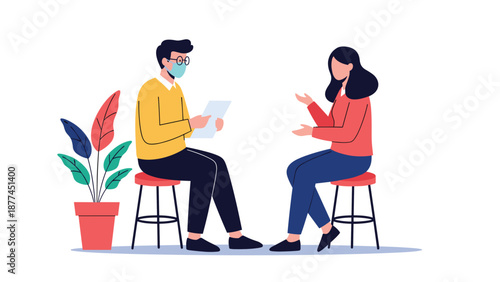 Man and woman wearing protective face masks having a formal interview or consultation while sitting on stools with a document and plant nearby.