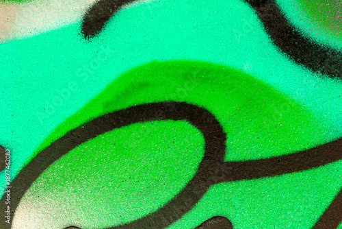 colorful background pattern of urban streen wall graffiti for concept and design. Aerosol bright vivid painting on a city walls