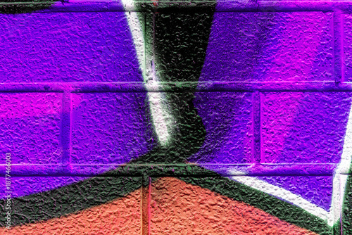 Beautiful brick wall colorful street art graffiti background. Abstract creative spray drawing fashion colors painting on the walls of the city. Urban Culture, aerosol texture