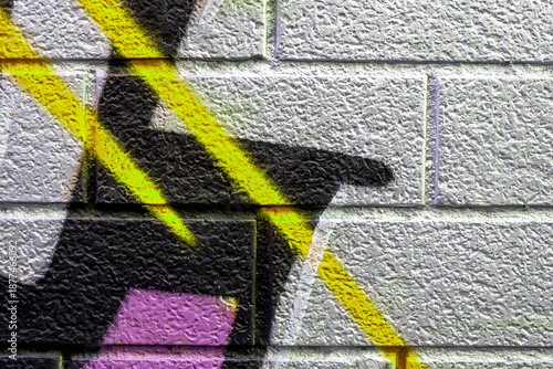 Beautiful bricks colorful street art graffiti background. Abstract gradient spray drawing fashion colors on the brick walls of the city. Urban metallic , red , white , grey , bright texture