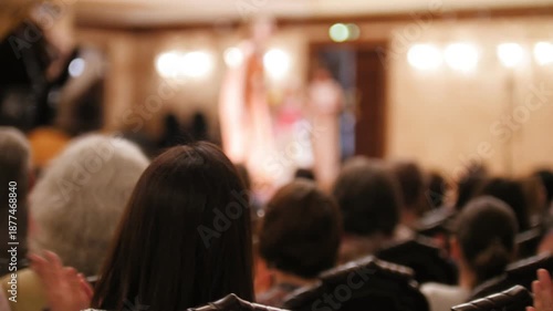 Wallpaper Mural Spectators are watching theatrical performance - bald man and woman Torontodigital.ca