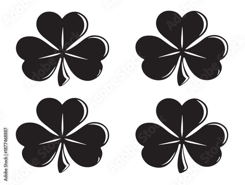 A gorgeous set of four intricate black detailed shamrock vector icons
