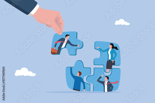 Businessman hand HR put new joiner to connect jigsaw puzzle, new joiner to fill in team and solve problem, teamwork to get solution, put right man in the right job to fit job description concept.