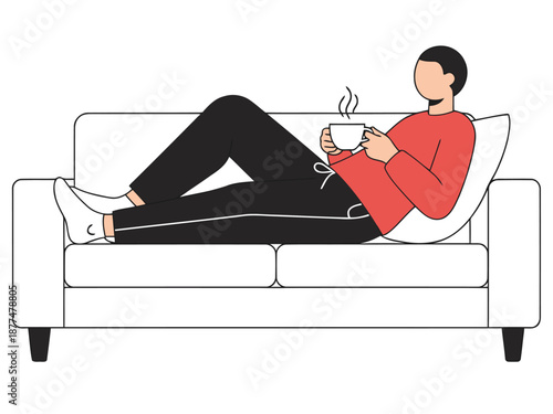 Relaxing man enjoys a cozy moment on a sofa with a beverage. Comfortable loungewear and a simple setting evoke a feeling of ease and contentment.