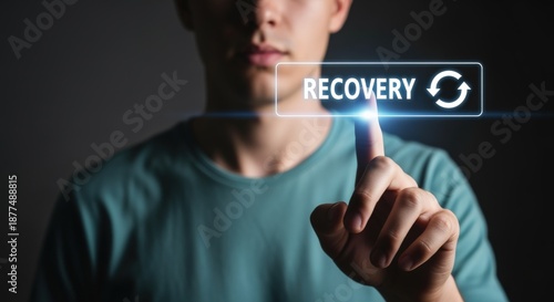 Man Activating Digital Recovery Button, symbolizing Data Backup, System Restoration, and Business Continuity Planning