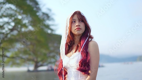 Young woman in a boat at sunset