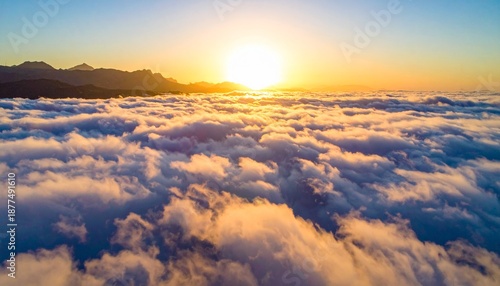 Golden Sunrise Above a Sea of Clouds, Creating a Breathtaking Aerial View.