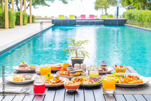 Luxurious brunch spread near poolside setting, featuring vibrant fresh