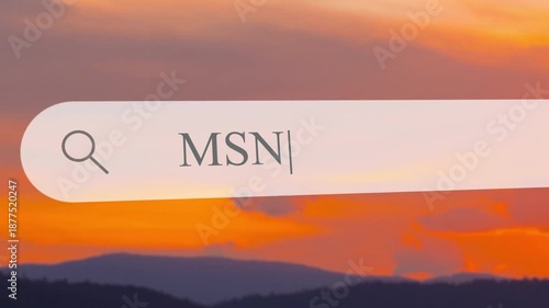 User types in search term on address bar to find information. The scene shows a sunset view over mountains and water, creating a warm backdrop for the search.