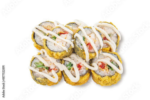 Closeup tempura sushi rolls filled with vegetables and seafood or chicken, topped with mayonnaise sauce, isolated on white background for menus and delivery