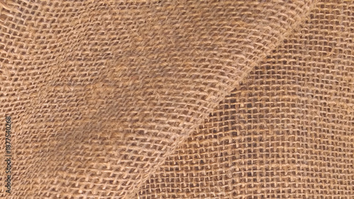 Brown sackcloth texture or background and empty space. Jute burlap canvas texture. Background for text and picture.