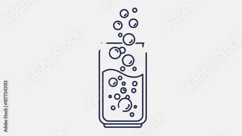 A glass of fizzy drink with bubbles.