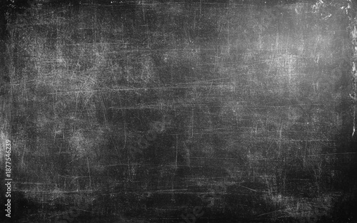 Blank blackboard with traces of erased chalk photo. Dark Blackboard of Chalkboard Texture Background.