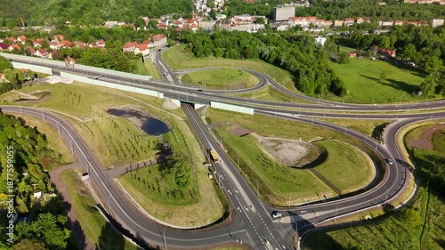 Aerial View of Highway Passing Through Residential Area and Forest Hills – Summer in Europe