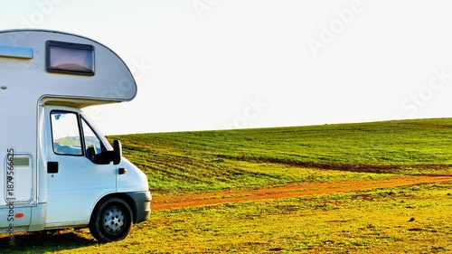 motorhome, camper van in countryside, road trip, vacation, freedom concept
