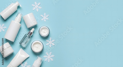 Winter skincare essentials a flat lay featuring white cosmetic products and snowflakes