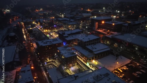 Wallpaper Mural Snowy rooftops of buildings. and houses in downtown of Lynchburg at night. Warm glowing lantern and lights along streets during christmas season. Aerial top down shot. Torontodigital.ca
