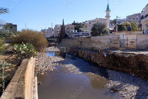 The Zarqa stream in the city of Zarqa, north of the Jordanian capital Amman, shows the dirt that pollutes the stream.