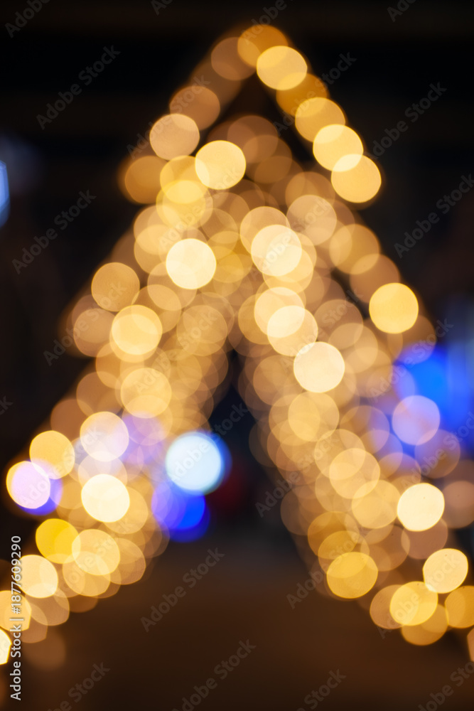 Fototapeta premium Blurred Golden Christmas Tree Lights Bokeh Background