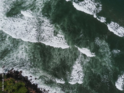 Powerful ocean waves crashing on rocky coast in Sri Lanka