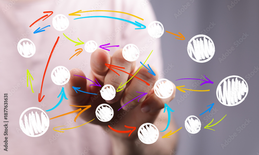 Obraz premium A human hand interacts with a digital network, showcasing data flow, connections, and strategic planning. Ideal for business, tech, and communic