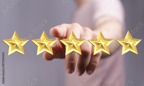 Person pointing to five gol...