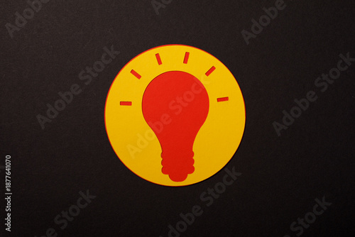 Bright lightbulb art on bla...