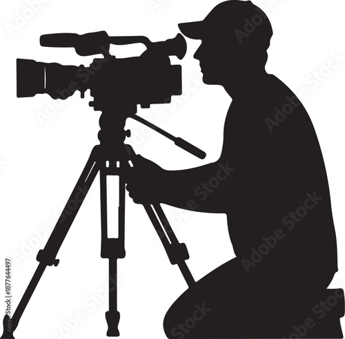 Silhouette of a man operating a video camera outdoors