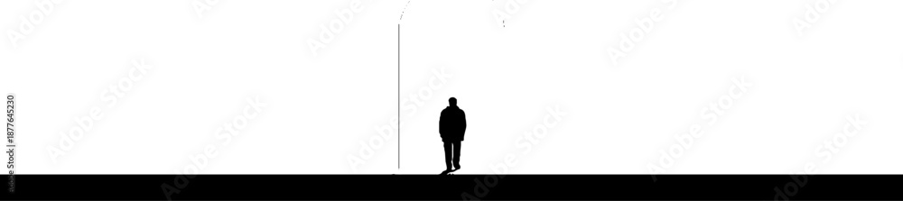 Fototapeta premium Silhouette of a lone male against a minimalist urban backdrop