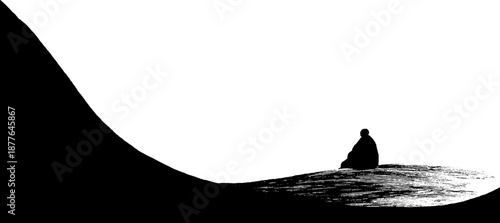 Silhouette of solitary figure on hillside under vast sky