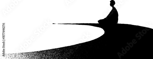 Silhouette of person meditating by a lake at sunset