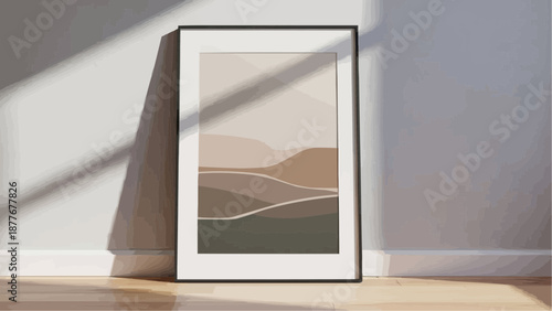 a framed abstract landscape artwork leaning against a wall in a room with natural light