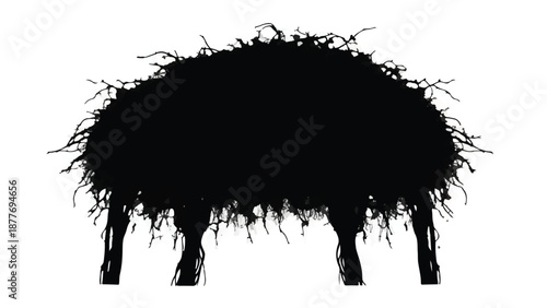 Silhouette of a shaggy, dark sheep standing on four legs