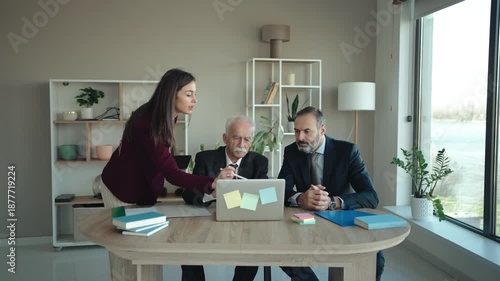 Multi-Generational Business Team Explaining Work to Senior Executive in Modern Office – Family Business Concept
