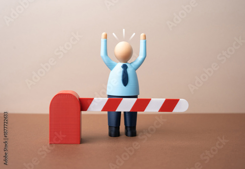 Fényképezés An office worker stands behind a closed barrier