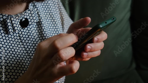 Woman scrolling smartphone. Person using mobile phone.