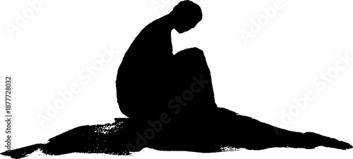 Silhouette of a contemplative young adult in solitude