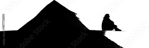 Silhouette of person by pyramid in minimalist black and white design